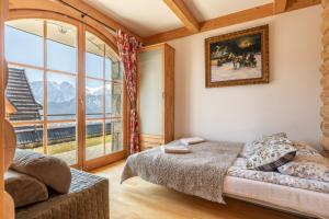 Posteľ alebo postele v izbe v ubytovaní Apartamenty Stylowe Zakopane