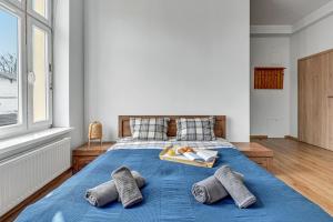 Łóżko lub łóżka w pokoju w obiekcie Blue Mandarin Apartments III Haffnera