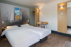 Postel nebo postele na pokoji v ubytování B&B HOTEL Auray Carnac + 37 fotografií
