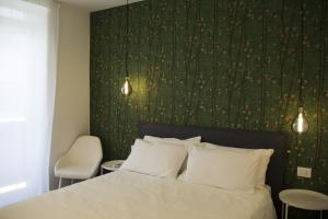 Katil atau katil-katil dalam bilik di Bloom Apartments