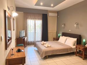 Posteľ alebo postele v izbe v ubytovaní Thrassa Hotel