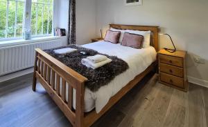 a bedroom with a large bed with two towels on it at Large 1 bed Apt, in the best location in Dublin! in Dublin