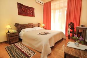 Voodi või voodid majutusasutuse Silk Road Hotel toas