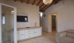 TV a/nebo společenská místnost v ubytování VILLETTA LA ZANCA