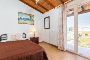 Postel nebo postele na pokoji v ubytování Nicolas Beach House