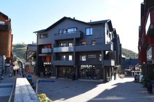 a large building on a street in a city at Levi Suites Unna Mànnu in Levi