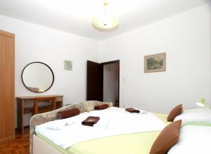 Posteľ alebo postele v izbe v ubytovaní Apartments Tomislav 2078
