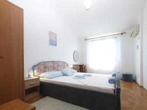 Posteľ alebo postele v izbe v ubytovaní Apartments Tomislav 2078
