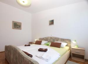 Posteľ alebo postele v izbe v ubytovaní Apartments Tomislav 2078