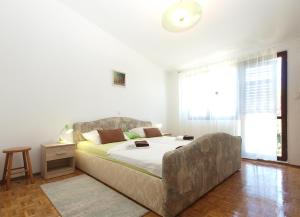 Posteľ alebo postele v izbe v ubytovaní Apartments Tomislav 2078