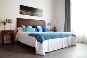 Postel nebo postele na pokoji v ubytování Colom Apartments