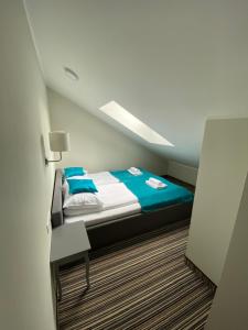 Posteľ alebo postele v izbe v ubytovaní Apartamenty Krynica No.1