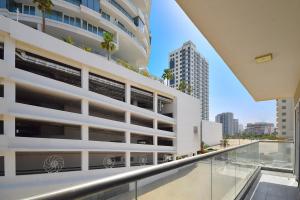 an external view of a building with a balcony at KeyHost - Large 1BR Apartment near Five Hotel JVC - Dubai - K310 in Dubai