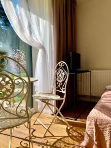 TV a/nebo společenská místnost v ubytování Kulautuva Park Apartments