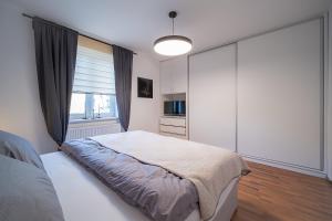 Postel nebo postele na pokoji v ubytování Apartmán U řeky