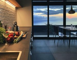 a kitchen with a table with a bowl of fruit on the counter at CANARIO in Las Indias