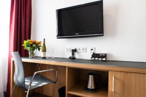 TV a/nebo společenská místnost v ubytování Hotel Kloster Eberbach
