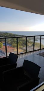 a living room with a view of the ocean at Snäck Apartment floor 11 sea view in Visby