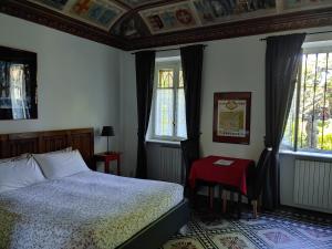 Cama o camas de una habitación en B&B Villa Ferrari