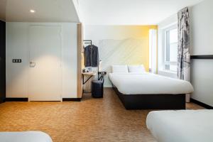 Katil atau katil-katil dalam bilik di B&B HOTEL Champigny-sur-Marne