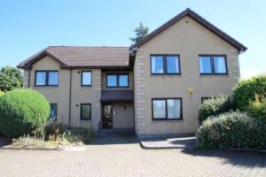 a large house with a lot of windows at In the heart of Inverness in Inverness