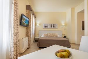 Postel nebo postele na pokoji v ubytování Hotel Regina Elena