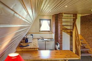 Kuchyň nebo kuchyňský kout v ubytování An der Steilküste Finnhütte 04 + 20 fotografií