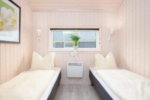 Voodi või voodid majutusasutuse Resort 2 Sea Lodge C 59 toas