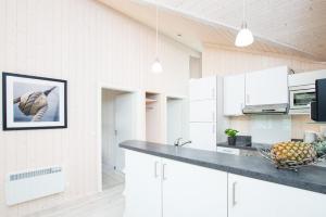Kuchyň nebo kuchyňský kout v ubytování Resort 2 Sea Lodge C 94