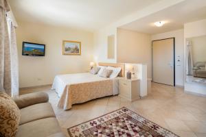 Postel nebo postele na pokoji v ubytování Hotel Regina Elena