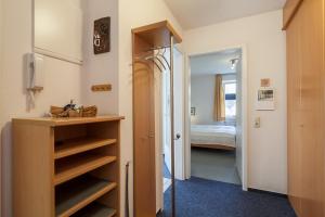 a small room with a bedroom with a bed at Dünenblick Wohnung 24 in Boltenhagen