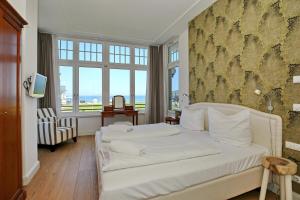 Cama ou camas em um quarto em Villa Rheingold - Wellgunde Wohnung 1b