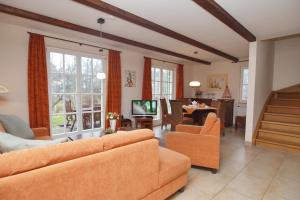 TV a/nebo společenská místnost v ubytování Ferienhaus Hanni