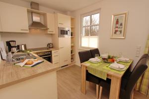 O bucătărie sau chicinetă la Residenz von Flotow Wohnung 03