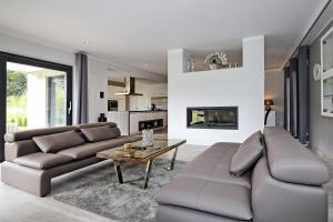 a living room with a couch and a table at Haus Wittenbeck Skorpion in Wittenbeck