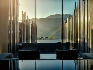 
a view through a glass window of a city at VIVOOD Landscape Hotel & Spa in Benimantell
