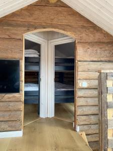 a small room with two bunk beds in a house at The Fryksås Chamber in Orsa