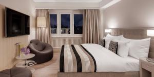 Voodi või voodid majutusasutuse Boutique Hotel Wellenberg toas
