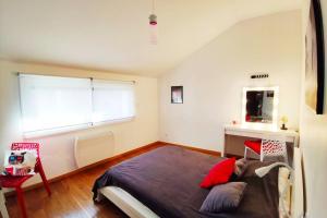 a bedroom with a large bed and a window at Loft 5* Centre, terras. park babyfoot clim vélos in Montélimar