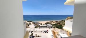 a view of the beach from a building at 9 Torre Sol - Casas & Papeis in Armação de Pêra