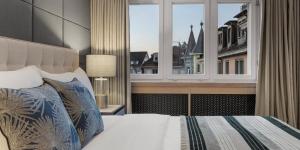 Voodi või voodid majutusasutuse Boutique Hotel Wellenberg toas