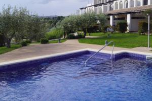 a swimming pool with a hose in the water at Casa Oliveres Beach en L' Ampolla in Perelló