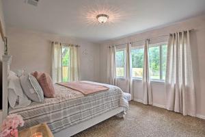 a bedroom with a bed and a large window at Cozy Canton Residence with Great Outdoor Space! in Canton
