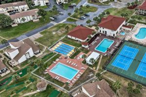 uma vista geral de uma casa com várias piscinas em PCB Resort Condo with Private Balcony and 3 Pools! em Panama City Beach