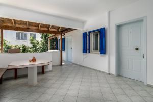 a hallway with a table and a door at Tina's Apartments in Adamantas