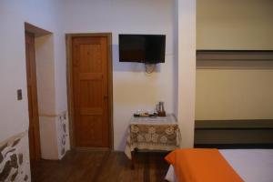 TV a/nebo společenská místnost v ubytování Hotel Samanapaq