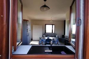 a kitchen with a tub in the middle of a room at Open Space a due passi dal mare in Ustica