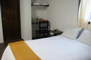 Postel nebo postele na pokoji v ubytování Hotel Samanapaq