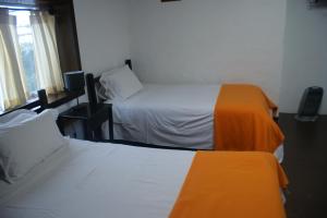Postel nebo postele na pokoji v ubytování Hotel Samanapaq