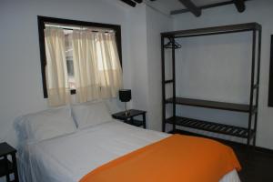 Postel nebo postele na pokoji v ubytování Hotel Samanapaq